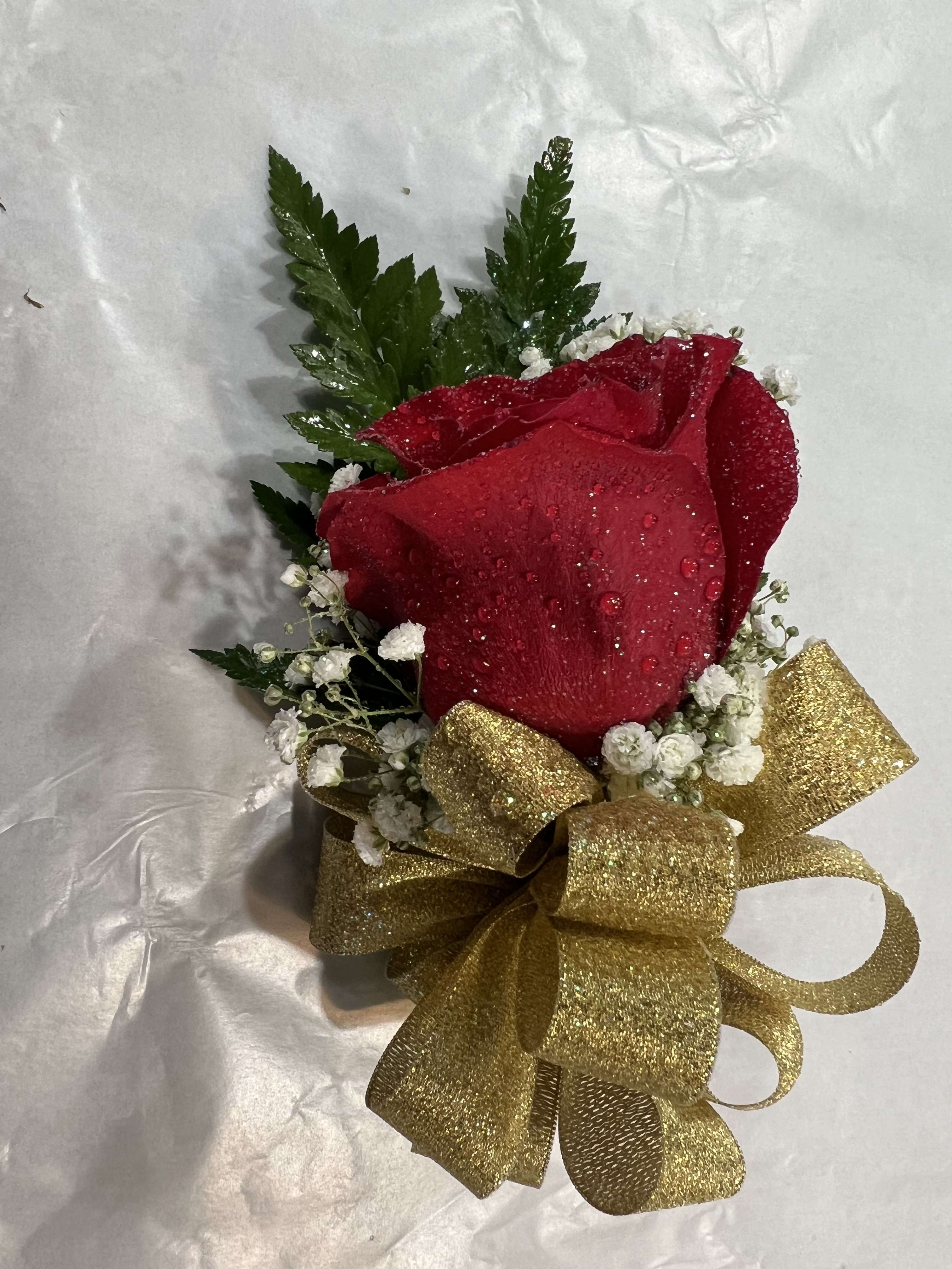 Red Rose corsage Red Rose corsage - A classic red rose corsage that compliments any outfit with a gold ribbon . A perfect addition for any prom, formal, or wedding event.