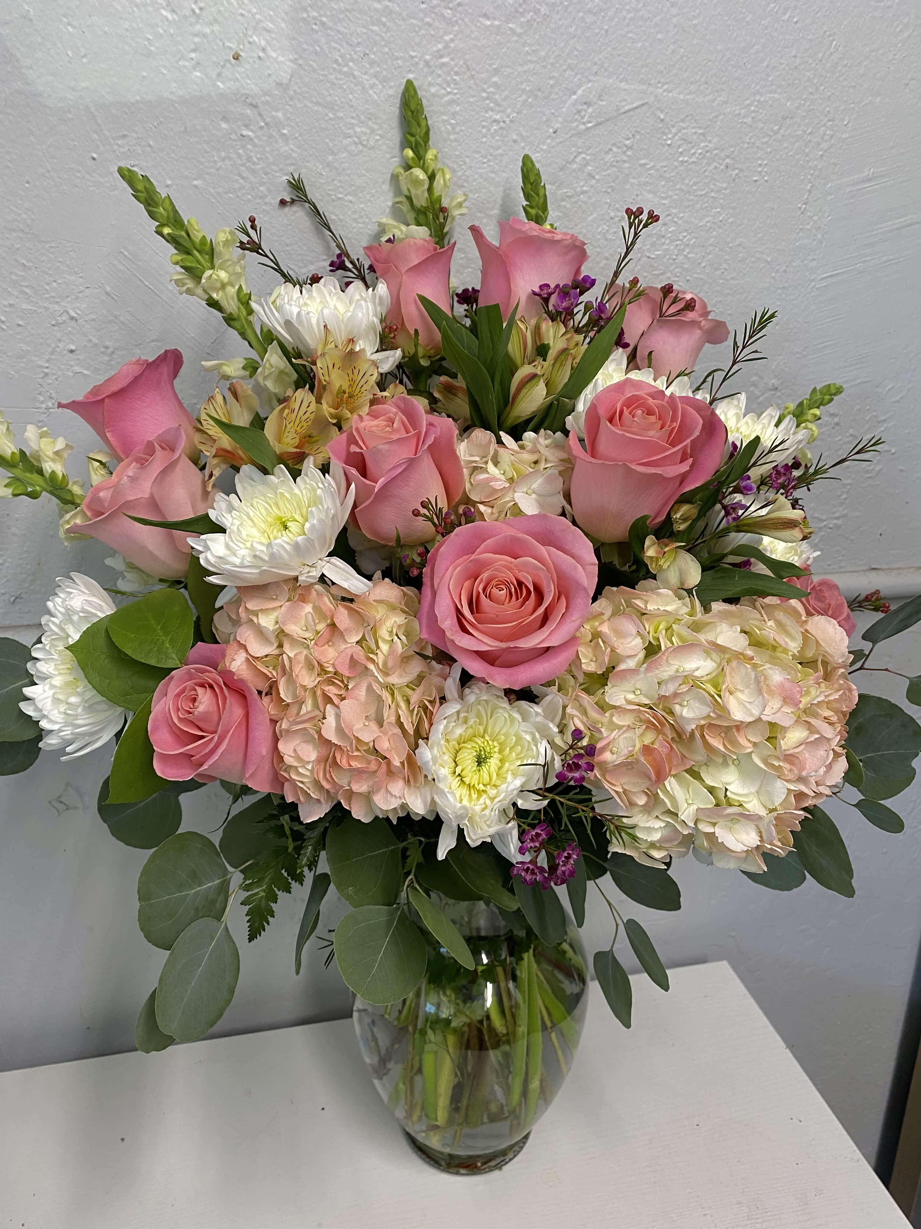 Cotton Candy Kiss Cotton Candy Kiss - Pink roses, pink hydrangeas, white cremon flowers, white snapdragon, alstroemerias and wax flowers