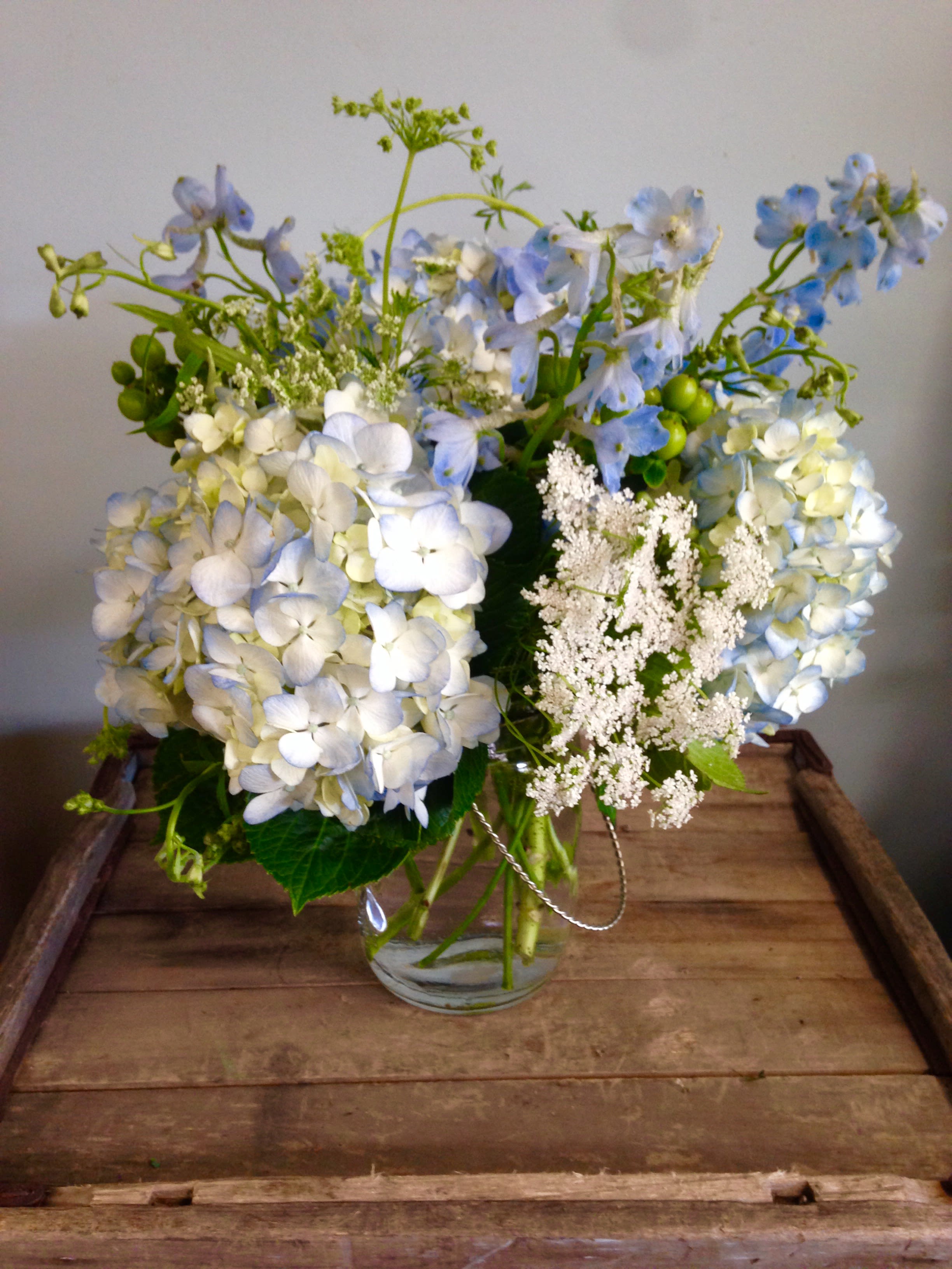 Cape Cod Summer - Celebrate Summer in New England with this cool blue arrangement that'll make you feel like you're on the Cape! Arranged loosely in a glass mason jar with a metal handle. 
