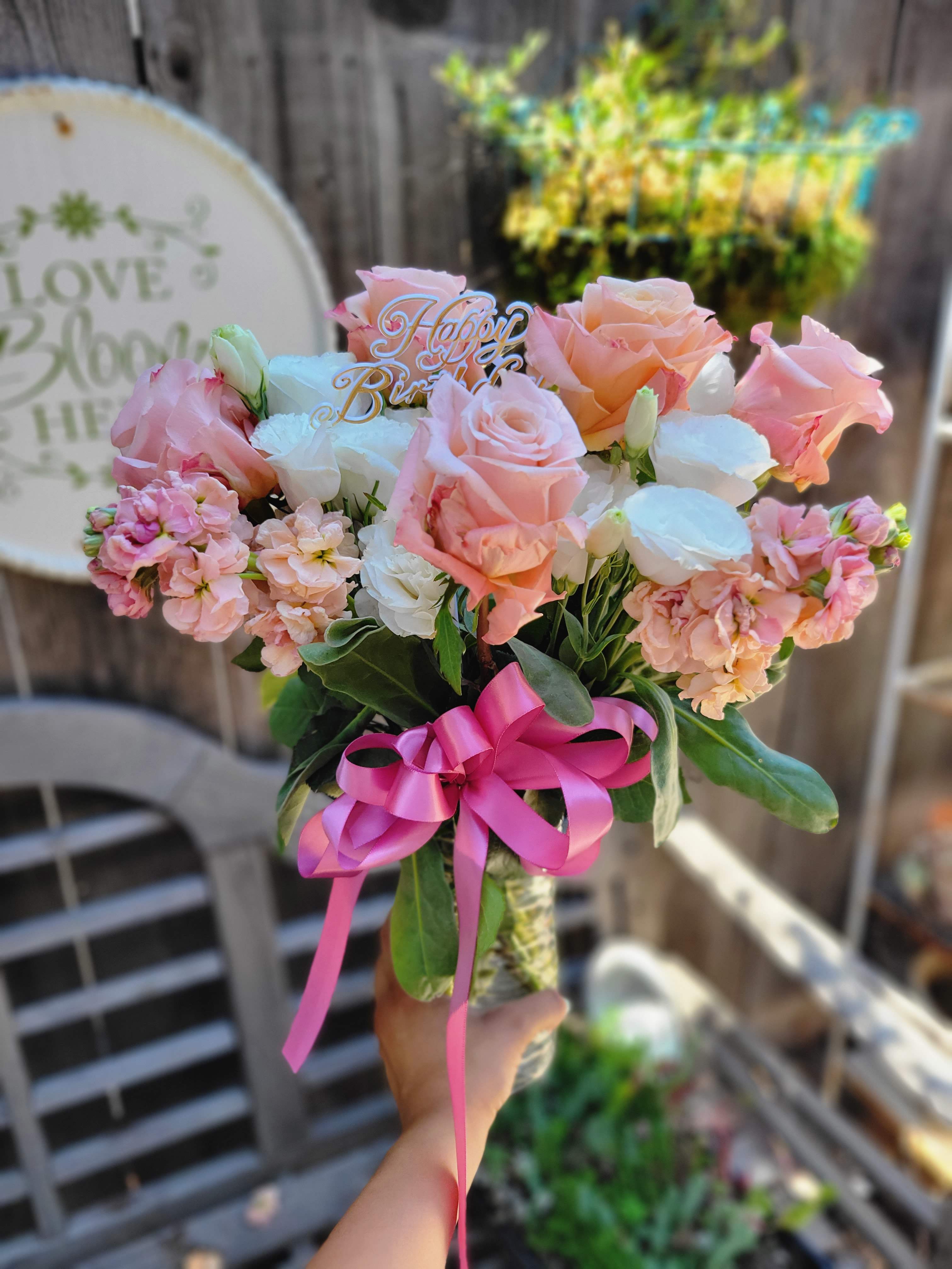 Beyond Blush - a sweet and simple bouquet in peach and white!  Featuring white lisanthus, peach stock, and peach roses!  Our standard size in this bouquet is designed around 5 focal roses  Our Deluxe is designed around 7 focal roses with and increase of supporting florals Our Premium is designed around 9 Focal Roses with an increase of supporting florals  appropriate substitutions for &quot;Beyond Blush&quot; are limited to floral varieties of peach and white. snap dragons, various variety of peach roses, spray roses, lily, daisy, &amp; pom pom. Our florist will chose the best available to create a beautiful design that honors the original look and feel.