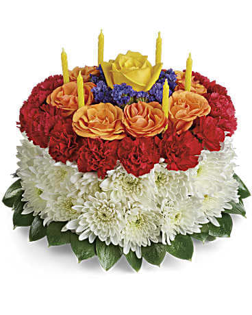 Your Wish Is Granted Birthday Cake Bouquet - A slice of birthday fun! Creative and colorful this birthday cake bouquet of roses carnations and mums is a fun-filled surprise on their special day. Birthday candles top it off in festive style!