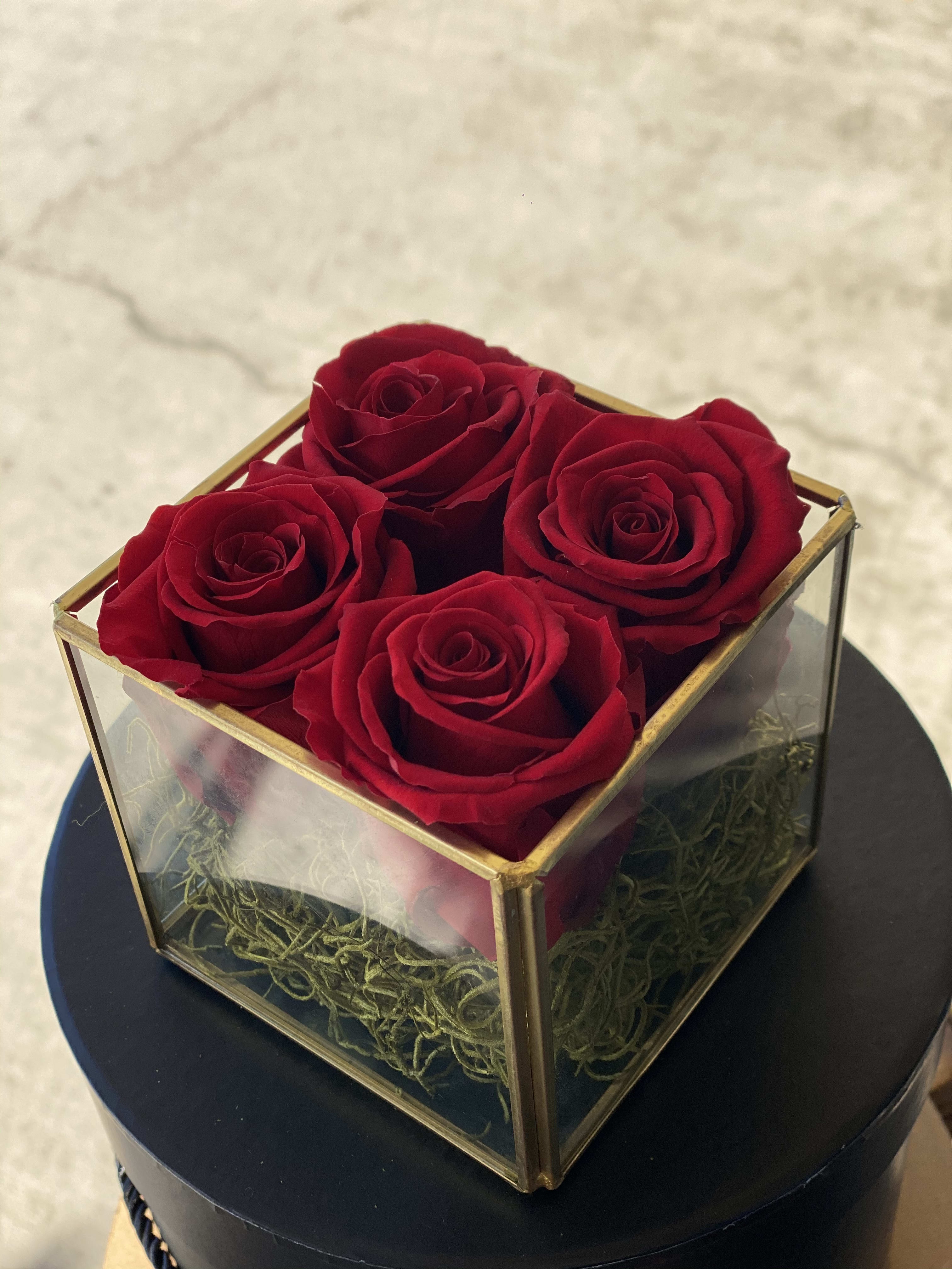 4-one year roses 4-one year roses - These are REAL roses that can last for up to a year! This case is composed of 4 Roses. While supplies last, color subject to change based on availability.