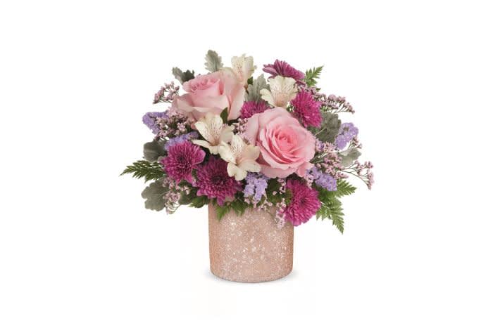 Blooming Brilliant Bouquet - Choose this British-inspired bouquet for mum–it’s Blooming Brilliant! Pink, purple, and white flowers are designed in a sparkling blush cylinder. The crushed glass texture on the cylinder is what makes this bouquet brilliant. Just like mom!