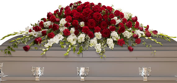 GARDEN OF GRANDEUR CASKET SPRAY - A traditional tribute that communicates deep love and eternal commitment. This dramatic red and white casket spray is ideal for a full couch or closed casket, mixing dozens of deep red roses with the pure white beauty of gladioli and stock.  