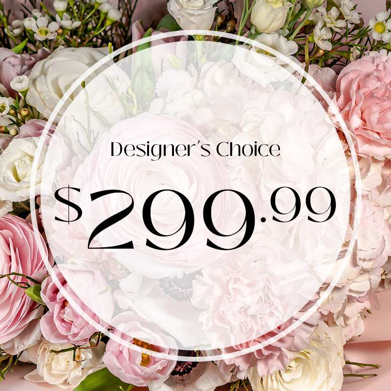 Designer's Choice 299.99 - &quot;Embrace the beauty of spontaneity with our Designer's Choice flower arrangement. Let our skilled florists craft a stunning masterpiece just for you, utilizing the freshest blooms and their creative expertise. Whether you're celebrating a special occasion or simply brightening someone's day, trust us to deliver a unique and exquisite arrangement that reflects the essence of elegance and natural charm.&quot;