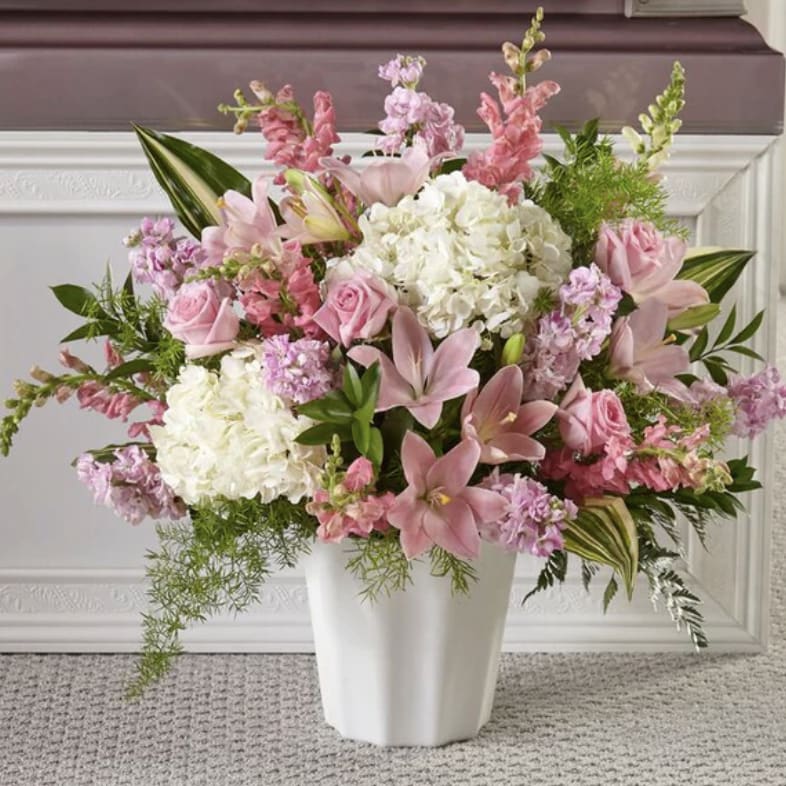 The Simply Serene Floor Basket   - Express your condolences in a genuine way with our Simply Serene Floor Basket. Our local florists understand that life is difficult during times of sensitivity. Each artisan takes great care in handcrafting this gorgeous arrangement of hydrangea, lilies and roses together to share your sympathies. 