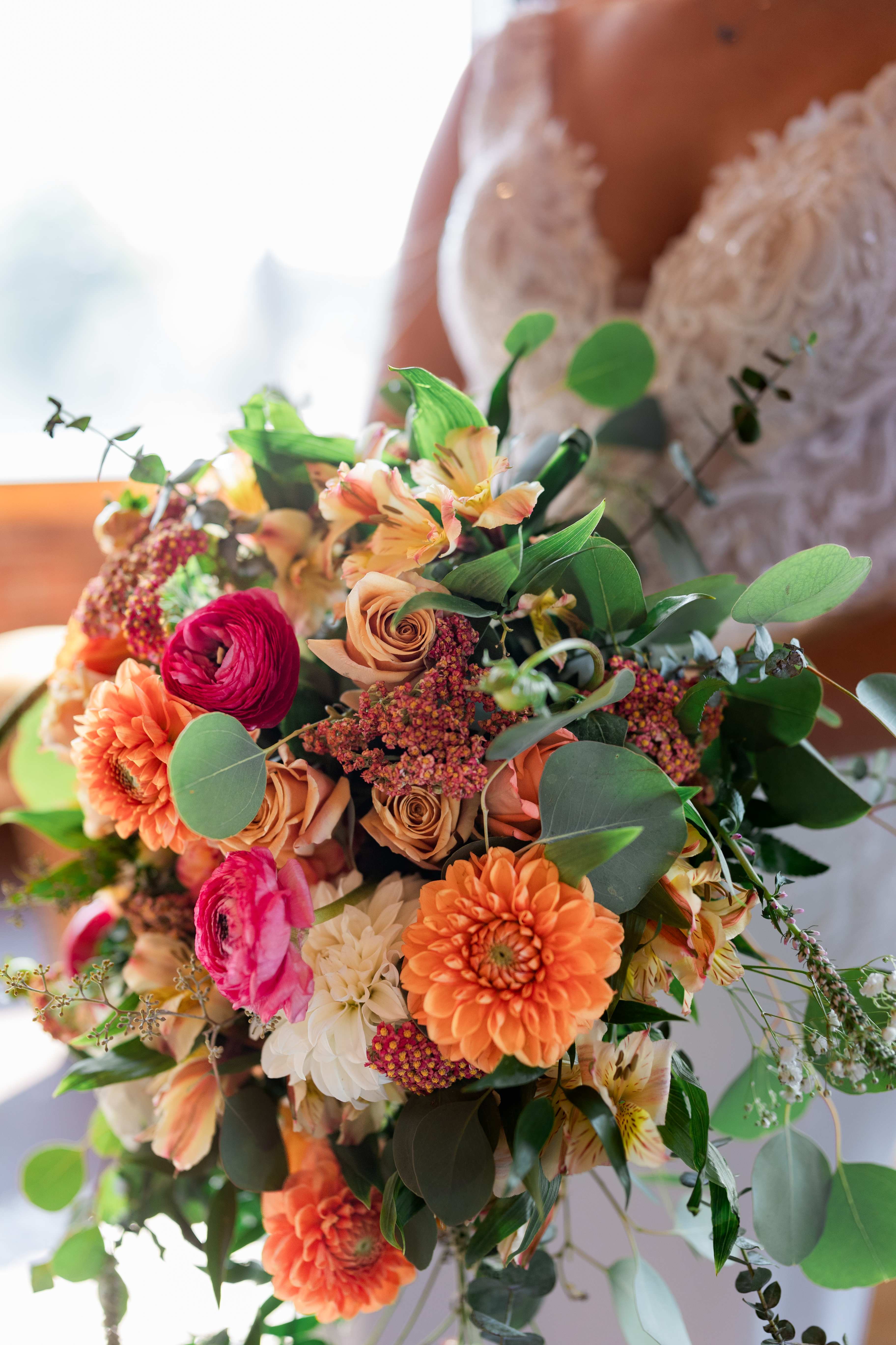 Allison K. bridal cascade - Beautiful fall colors mixed Vintage/ boho cascade with Dahlias, ranunculus's, roses and other filler flowers and eucalyptus greens