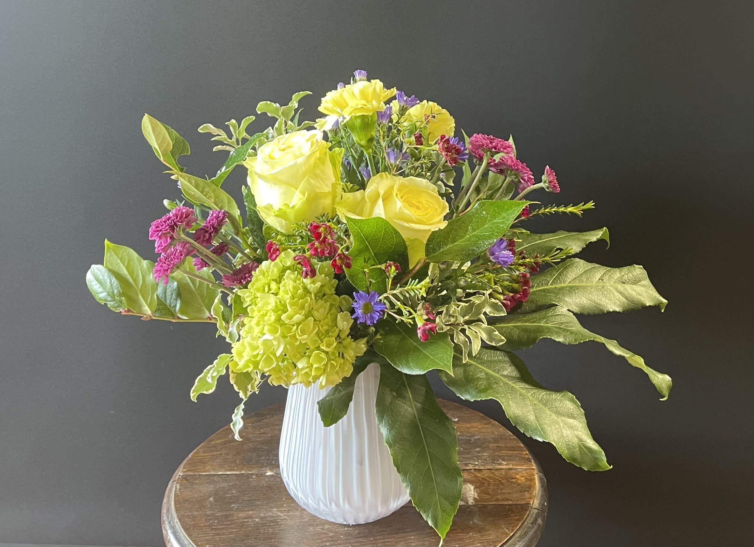 Spring is in the Air Bouquet - Bright and cheery bouquet in a sweet little vessel, sure to brighten anyone’s day!