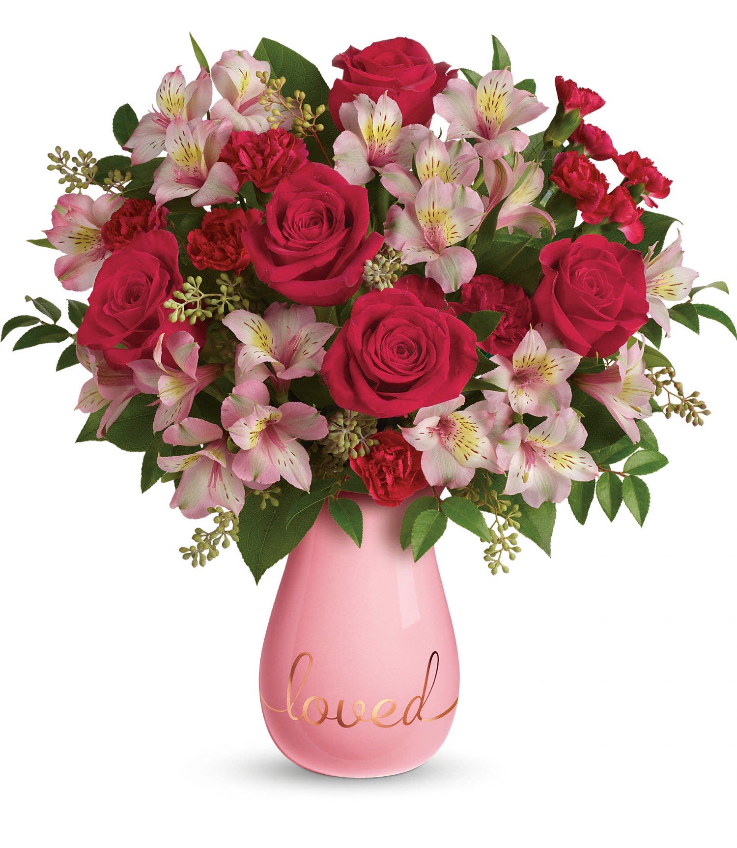 Teleflora's True Lovelies Bouquet PM Teleflora's True Lovelies Bouquet PM - Remind them just how "loved" they are with this sweet gift! In the prettiest shade of soft, blushing pink, this glazed ceramic vase features whimsical golden script and a graceful shape that's perfect beneath a breathtaking bouquet of roses, alstroemeria and carnations.