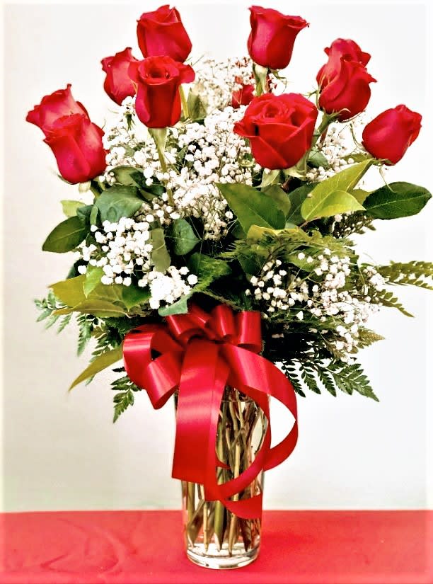 Dozen Long Stem Roses - One dozen long stem premium red roses in a glass rose vase. Also available in pink, hot pink, white, or a mix