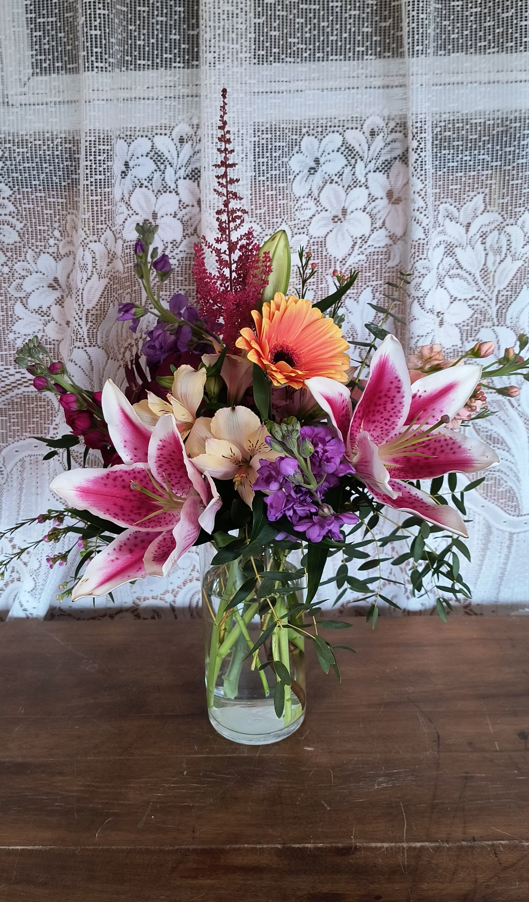 Designers Choice Country Garden - You can smell the garden! Designers choice of garden flowers arranged in a glass vase that may include alstroemeria, stock, lilies, gerberas and roses but not limited to.