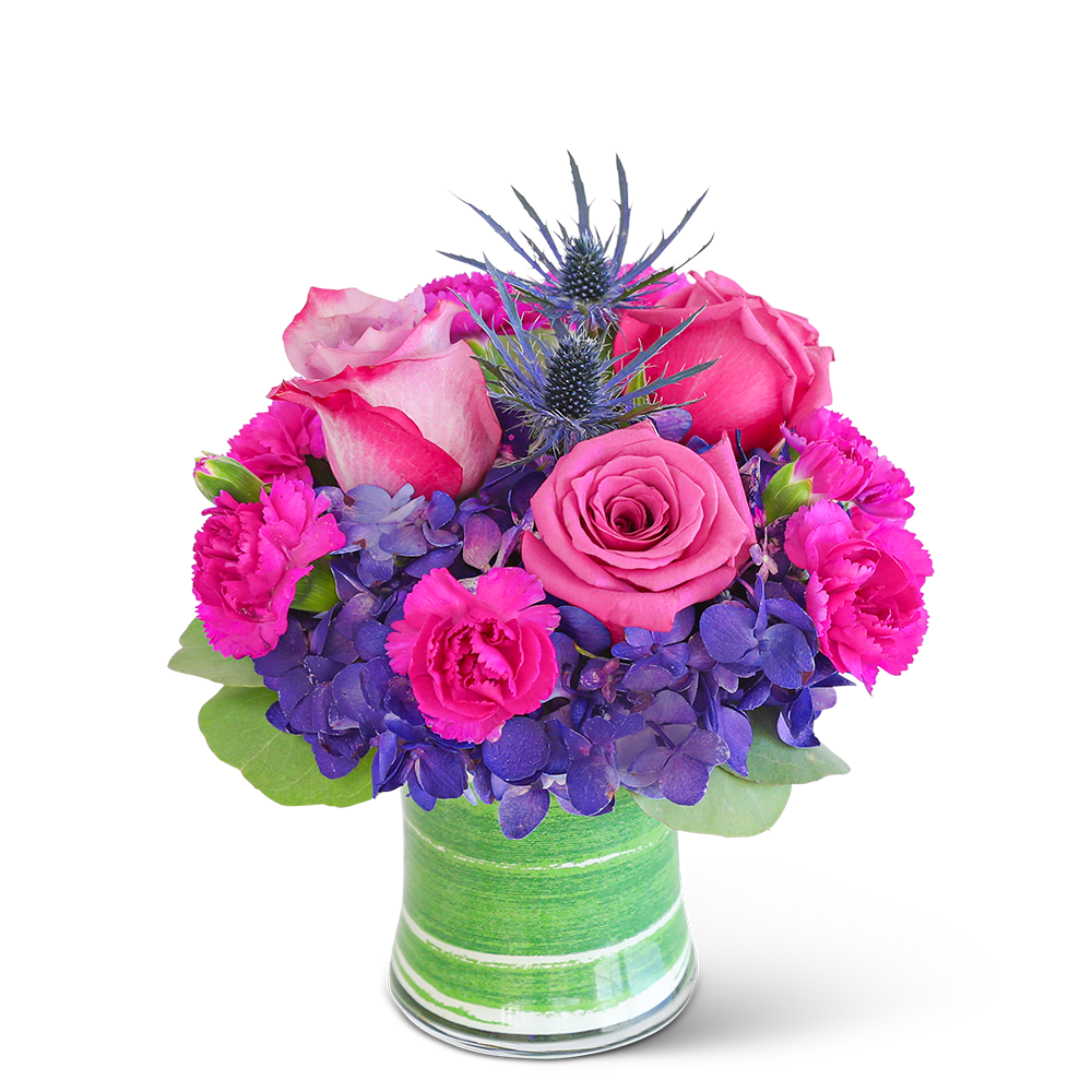 London Posh - Delight in the rich purple tones of one of our floral favorites, London Posh. A chic, leaf-lined vase with hydrangea, roses, carnations, and premium foliage makes up this gorgeous floral design. This vibrant flower arrangement will brighten anyone's day and add a pop of color to any space. It would make a perfect Anniversary or Birthday gift for that special someone.