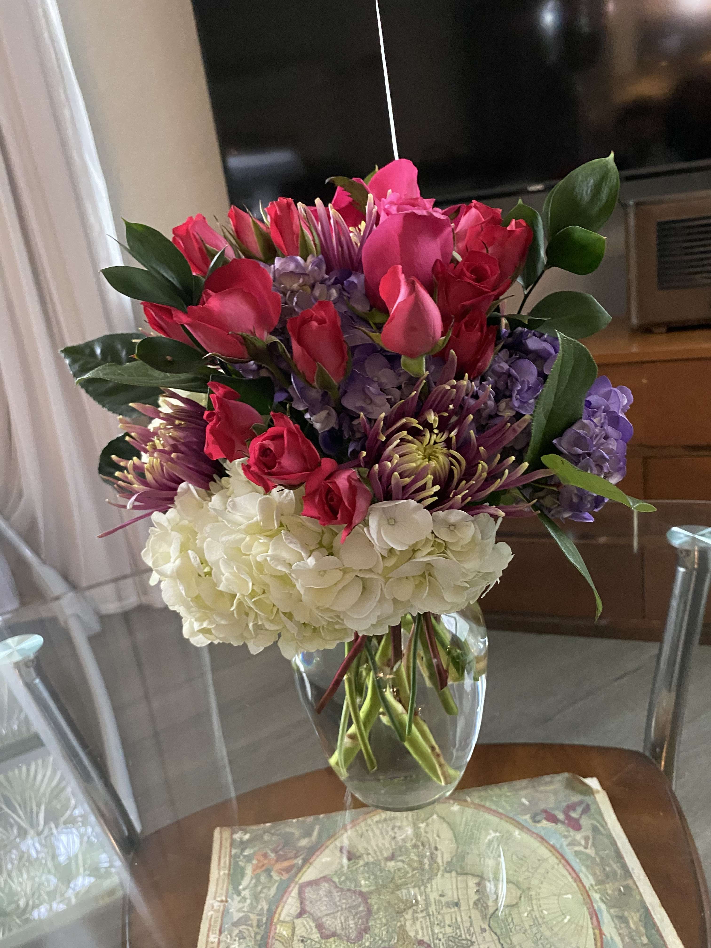 Hot pink beauty  - Beautiful flower arrangement with pink roses, white hydrangea carnations alstroemerias 