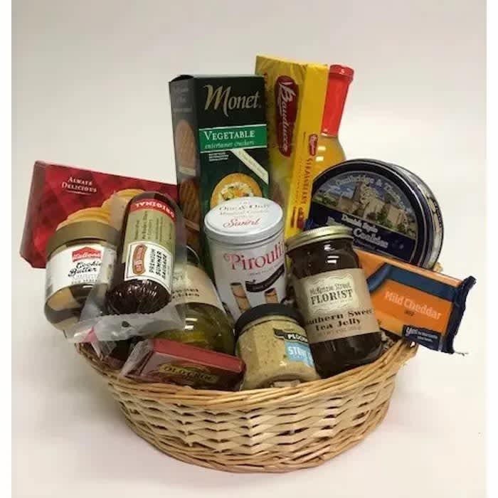 The Grand Gourmet - Candies, crackers, cheese, chocolates and more. The Grand Gourmet features a sweet and savory selection of treats that everyone will enjoy!  Enjoy this in a basket as shown, or we can make it a charcuterie board. Just let us know your preference. 