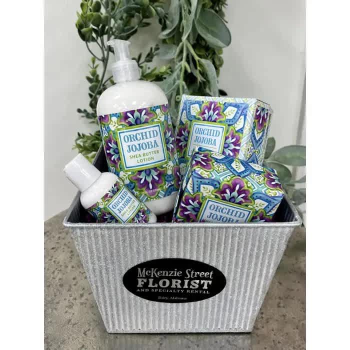 Pamper Me Basket - Orchid Jojoba Pamper Me Basket - Orchid Jojoba - Our Pamper Me Basket has wonderfully scented lotions, soaps, and powder. This one is Orchid Jojoba, a sweet, floral fragrance with the soothing benefits of shea butter, and the luxurious feel of cocoa butter, virgin olive oil, grapeseed oil, and vitamin E. It's sure to make you feel pampered!