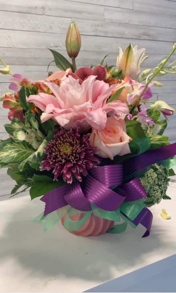 Passion - Pleasant Pastels is a soft wash of colors with a pop of hot pink snapdragons. It's the perfect pick-me-up to make them smile!