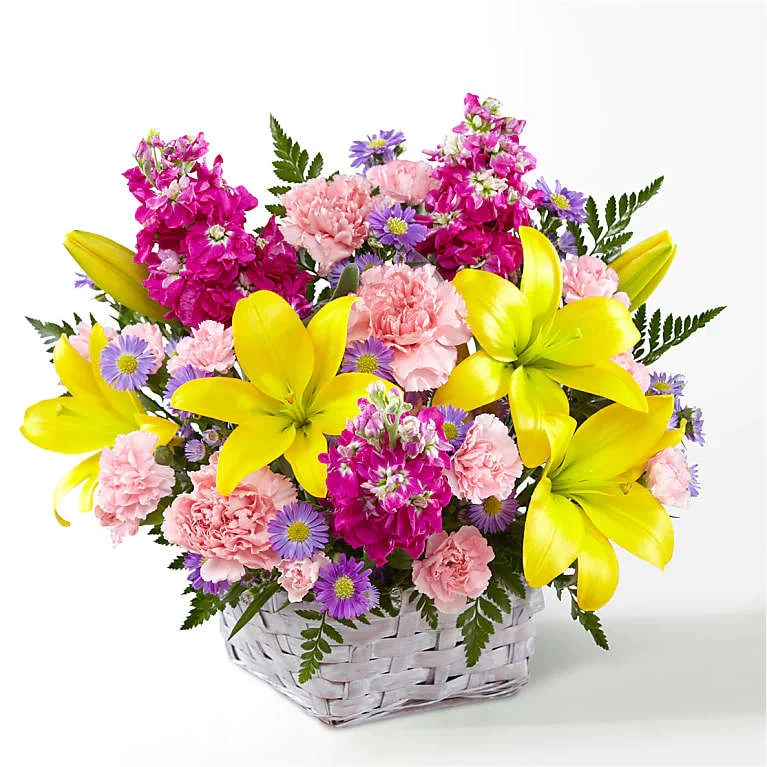 Bright Lights basket - Bring joy and color to your celebration with the Bright Lights Bouquet. Featuring vibrant springtime hues, this arrangement is perfect for adding a pop of color to your seasonal festivities.