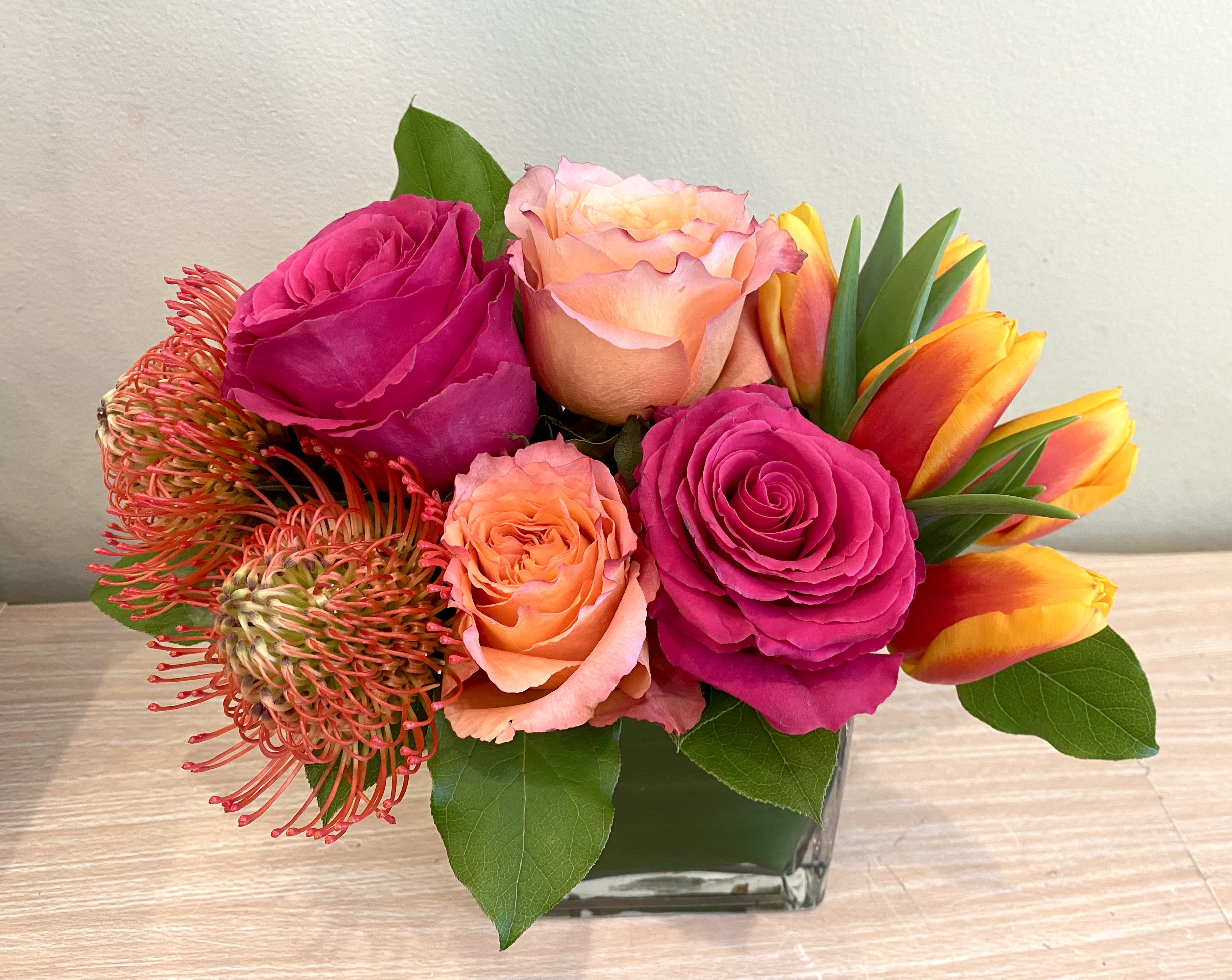 Free Spirit   - Free spirit roses for romance, tulips for spring, pin cushion protea for a trendy touch!  