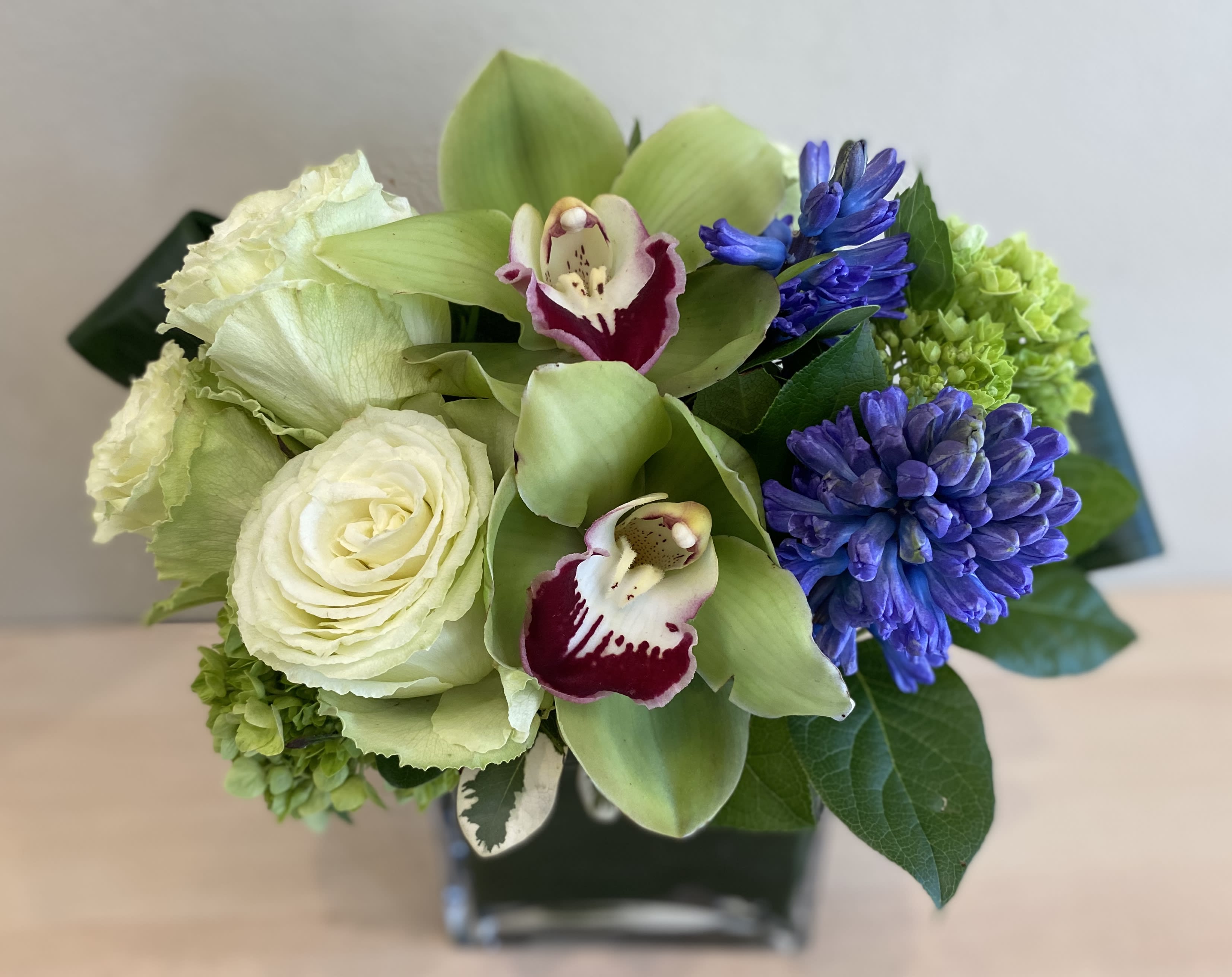Fragrant Touch - Fresh green lemonade roses, green cymbidium orchids, green hydrangea with a touch of beautiful blue fragrant hyacinth.