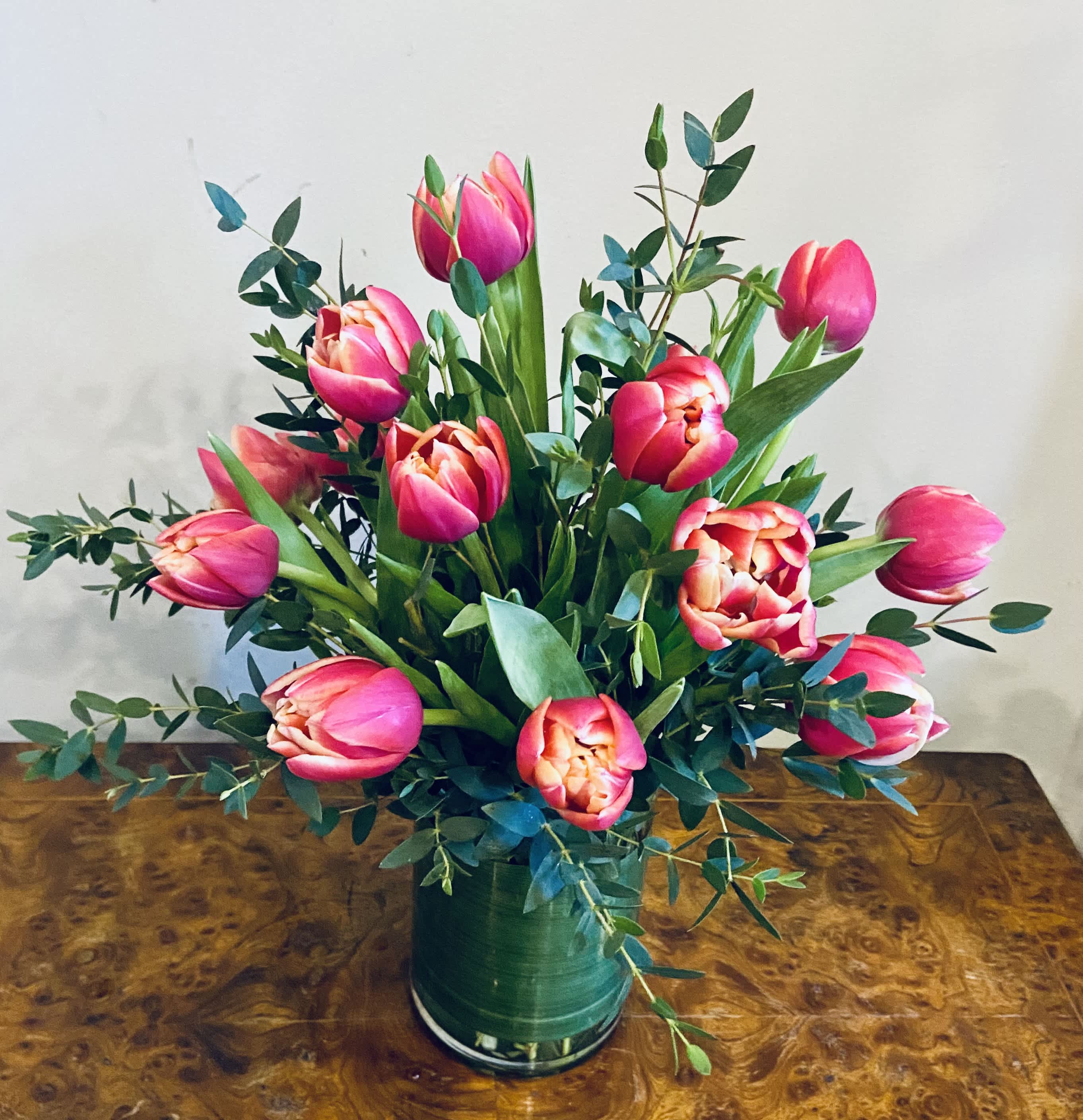 Lovely Spring Tulips - Lovely lipstick Dutch tulips arranged in a vase or clear glass cylinder. Best color of tulips available for the day will be used.