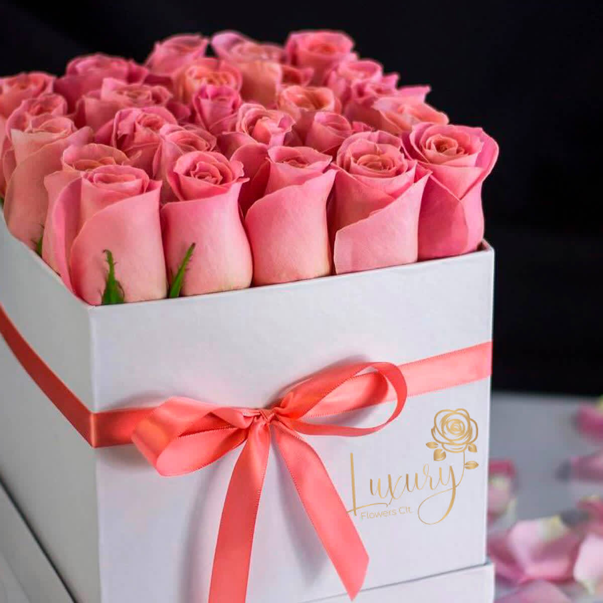 Forever Mine-Pink - •	Roses in Box: 24-30 stems of natural roses. •	Color Flower: Pink •	Color Box: White or Black (subject to inventory availability) •	All Occasion •	Place your Order Online Monday to Saturday before 1:00 p.m. (E.T.) for same-day          delivery.  •	“Orders received after hours will be delivered the next business day”. •	Check our coverage area. •	Occasionally, substitutions of flowers and/or containers happen due to weather,          seasonality, and market conditions which may affect availability. If this is the case with          the gift you’ve selected, we will ensure that the style, theme, and color scheme of your          arrangement are preserved and will only substitute items of equal value or higher value.  CARE INSTRUCTIONS Gently mist the arrangement with natural water every other day. Do not spray any cleaning product on the flower arrangement. Do not place heavy objects directly on the flower arrangement. Keep them out of direct sunlight and extreme heat. 