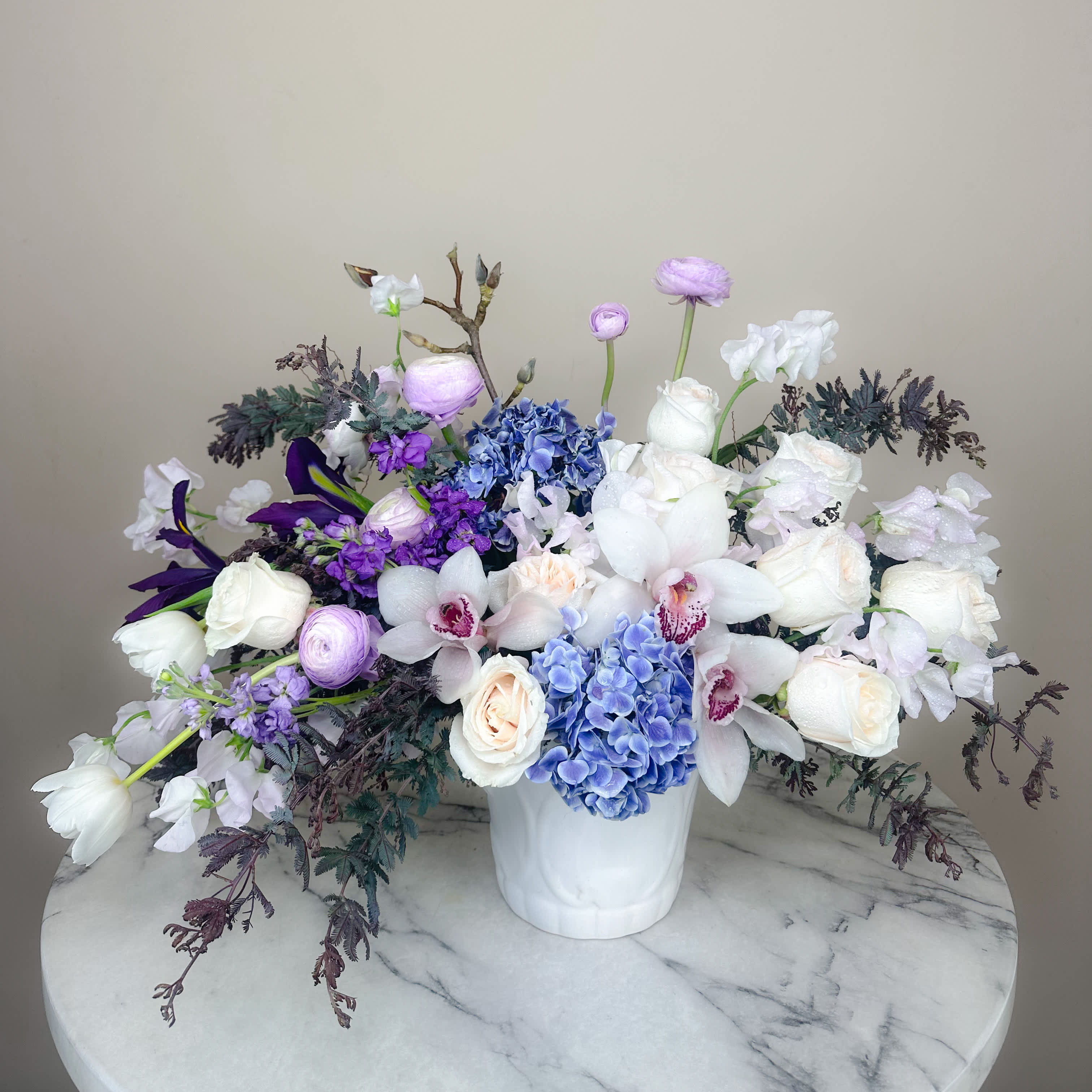Spring Amethyst - Inspired by the beauty of amethyst crystals, this bouquet of purple, lavender and white florals will resonate your deep love and dedication as the energy flows calm and serene. Let nature takes its course as the romance linger…  