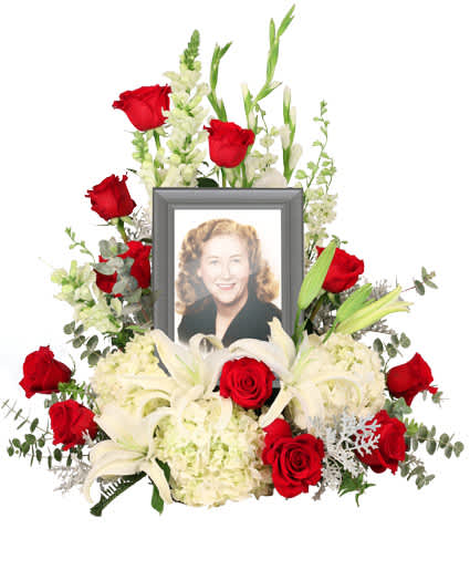 MISSING YOU MEMORIAL MISSING YOU MEMORIAL - Honor and celebrate the fruitful life of a lost loved one with an arrangement that truly encompasses their elegance. The Missing You memorial arrangement is a luxurious addition to any memorial service. Encompassing a 5 x 7 picture of your choice, this arrangement features majestic white hydrangeas that will ease the minds and comfort the souls that are grieving with contrasting red roses to represent the vibrance of their life. Picture Frame Not Included