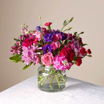 Sweet Thing - Tell your recipient they are the Sweetest Thing with a bouquet composed of jewel–toned florals, like blooming roses, sweet alstroemeria, fragrant stock, and more.  Please Note: The bouquet pictured reflects our original design for this product. While we always try to follow the color palette, we may replace stems to deliver the freshest bouquet possible, and we may sometimes need to use a different vase.  Approx 12&quot;- 15&quot; H