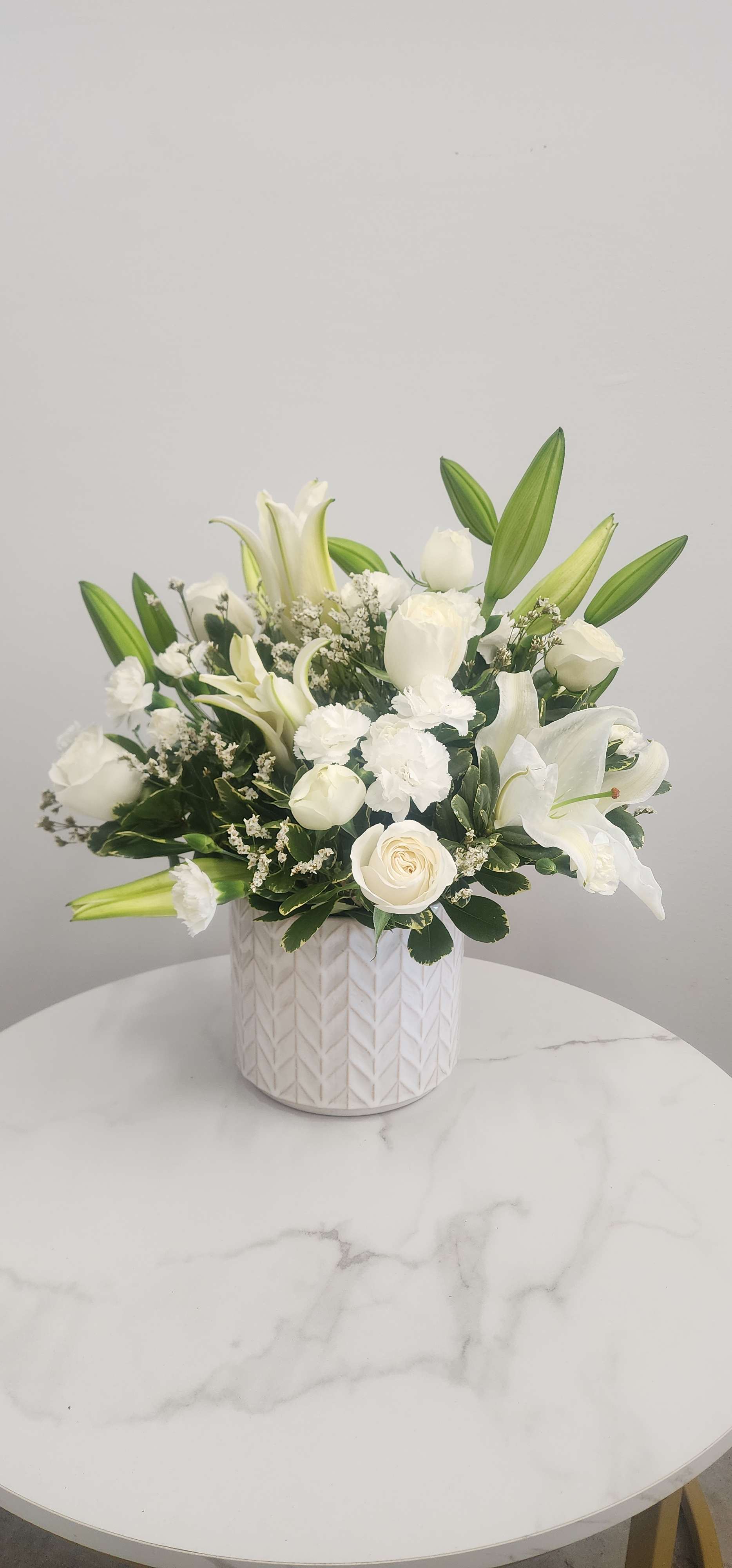  Loving Lilies and Roses Bouquet  - A simply beautiful way to show you care. By sending this elegant arrangement to the home of those in mourning, you are letting them know they are embraced in your thoughts. And in your heart. 