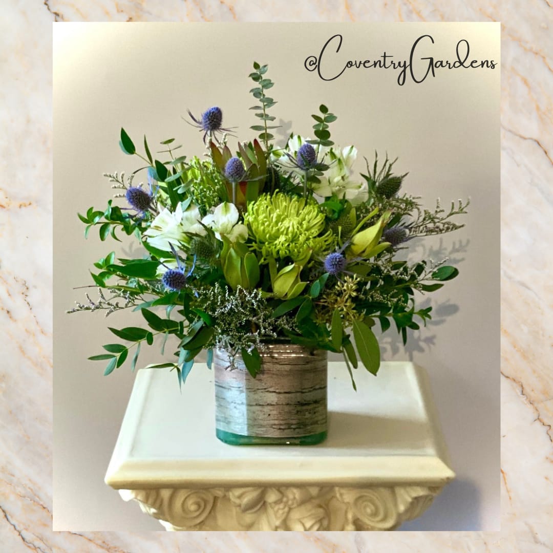 Thoughts of You ~ Bliss - Our “Thoughts of you” collection is a 3/4 design in a 5&quot; cube. This Bliss arrangement focuses on cream, white and terrain color palette. (Design may differ in blooms, we focus on seasonal and fresh). 