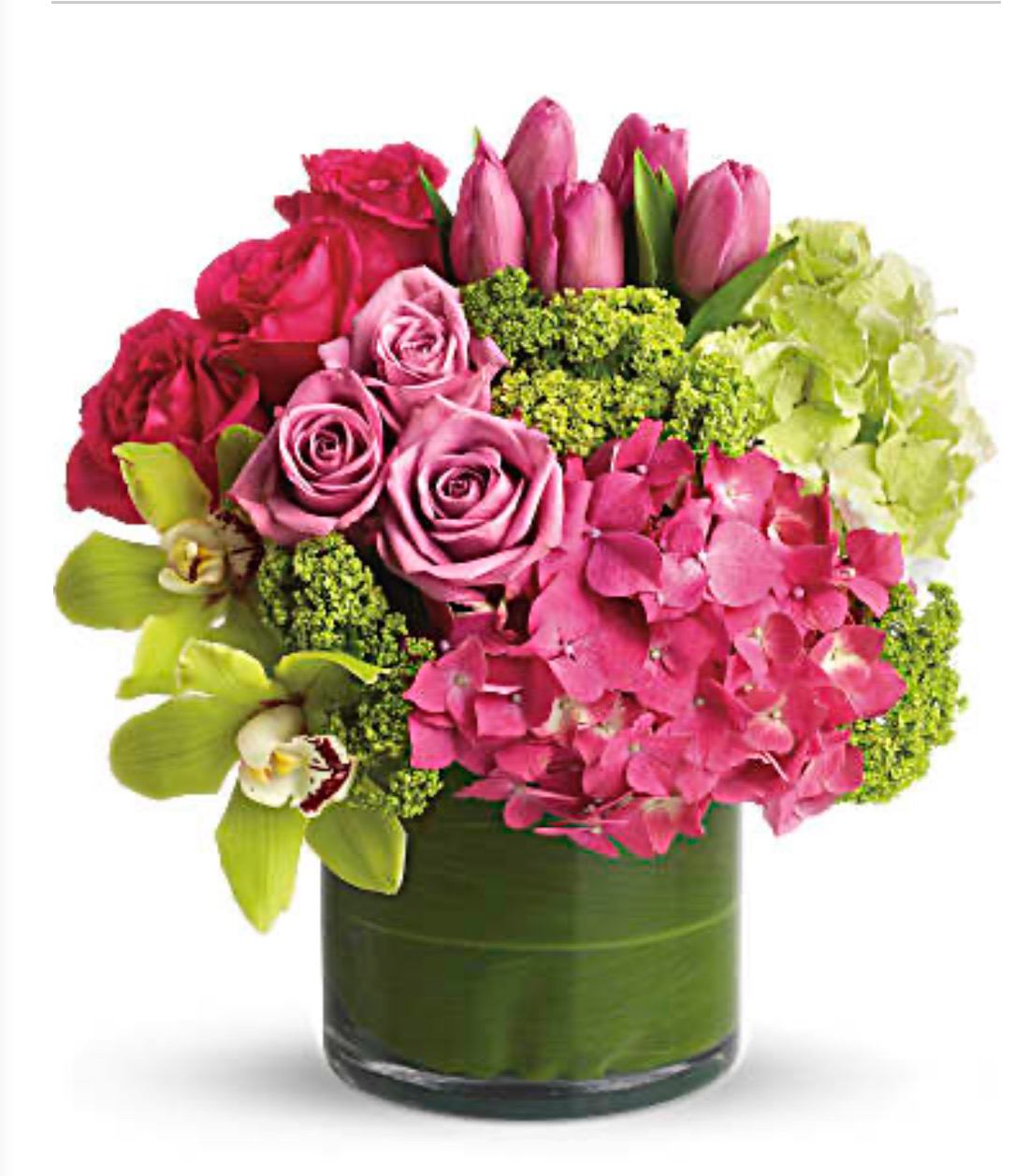  Exquisite Beauty  - This exquisite mix of feminine blooms is like a breath of fresh air! Sweet pinks and purples are contrasted with a modern burst of fresh green hydrangea, and finished off with a pretty lavender cube vase lined with a tropical aspidistra leaf. It's a fun pick-me-up to send anytime, anywhere!