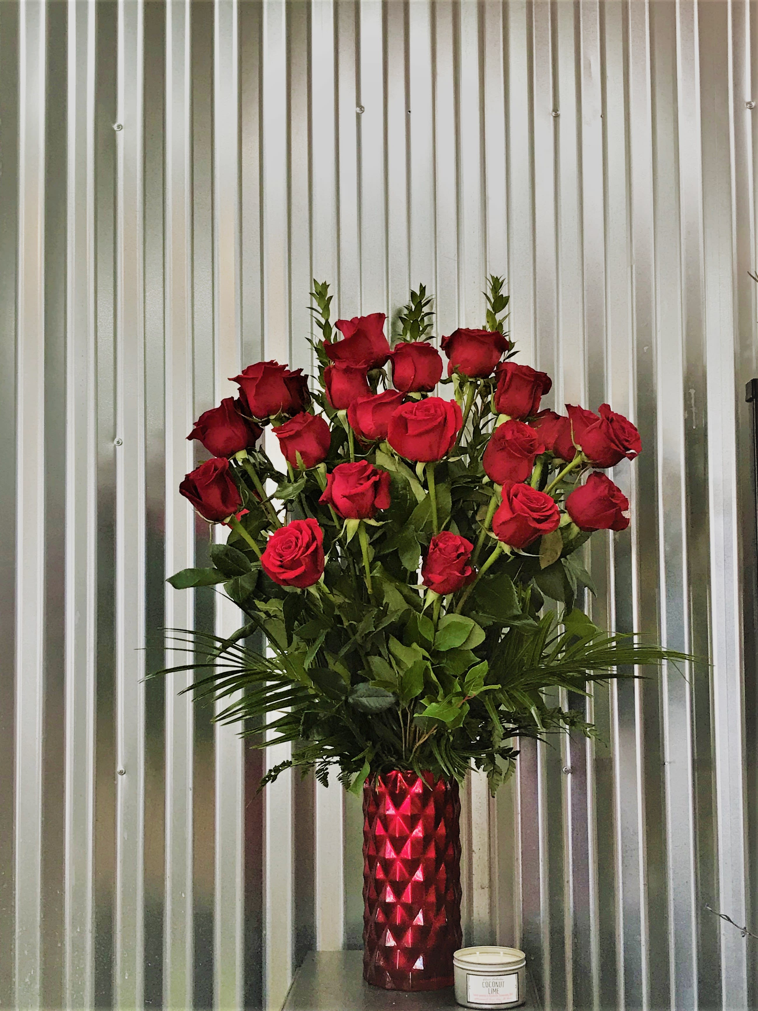 Grand Rose Bouquet - Two Dozen Red Roses - Two dozen premium red roses designed in an opulent ruby red vase. Large and beautiful, remarkably sure to make a statement for any occasion.