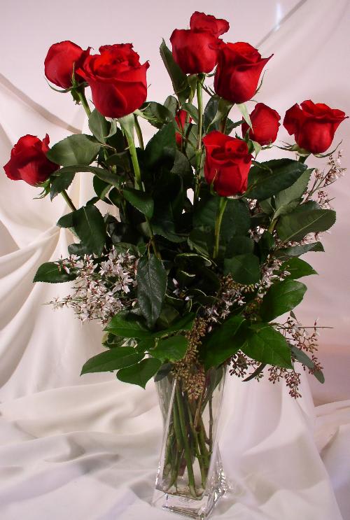 Dozen Vased Roses - A traditional vase of red roses....soft, beautiful and romantic. This particular vase is no longer available, but a wonderful substitute will be used.