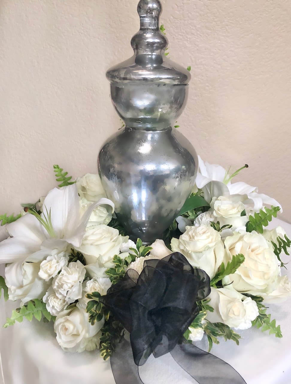 Memorial Urn Wreath - A traditional floral wreath to display an urn for a funeral service or home memorial.  (Urn not included)