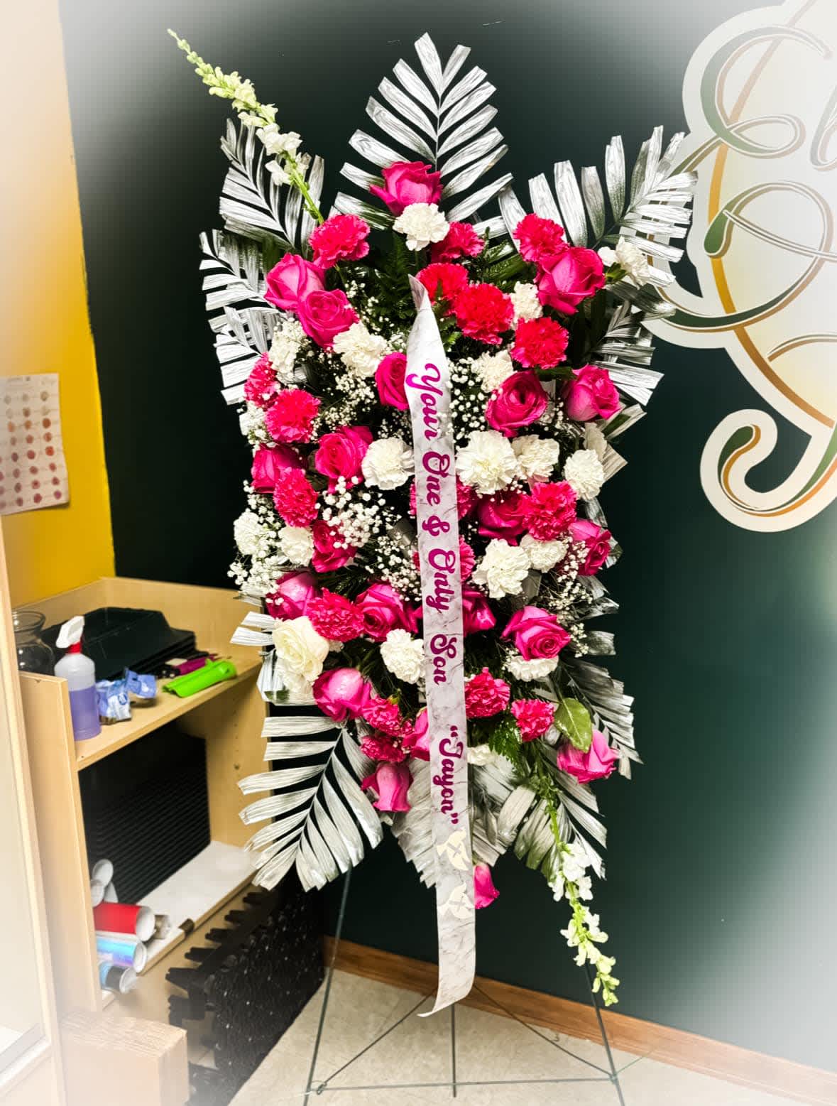Pink and White Sympathy Standing Spray - This Elegant Arrangement has beautiful pink roses and white Carnations.  