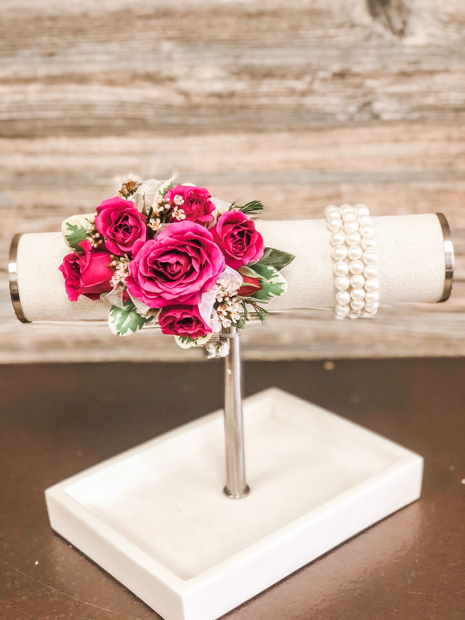 Hot Pink Spray Rose Corsage with Upgraded Wristlet - Hot pink spray roses, sheer ribbon, white or light pink filler flower on a bed of greenery.  Wristlet and ribbon color can be customized.   Ribbon:  can match or compliment any dress color Wristlets: white, pearl beaded band. 