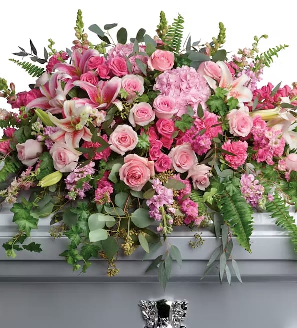 Lasting Memories of You Lasting Memories of You - A lush profusion of roses, hydrangeas, stock, snapdragons, larkspur, carnations, lilies, ferns and eucalyptus. (Note: Arrangement will be filled with the highest quality, freshest flowers available to the value of the order and therefore flower substitutions may be necessary.)