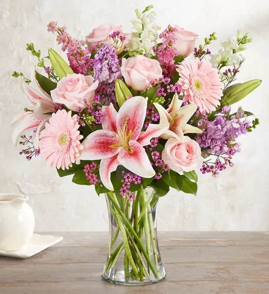 in Loving Memory Bouquet for Sympathy - Honor a loving memory with our beautiful garden-inspired bouquet. Gathered with a mix of pink and purple blooms, it’s a warm and heartfelt expression of your deepest condolences.