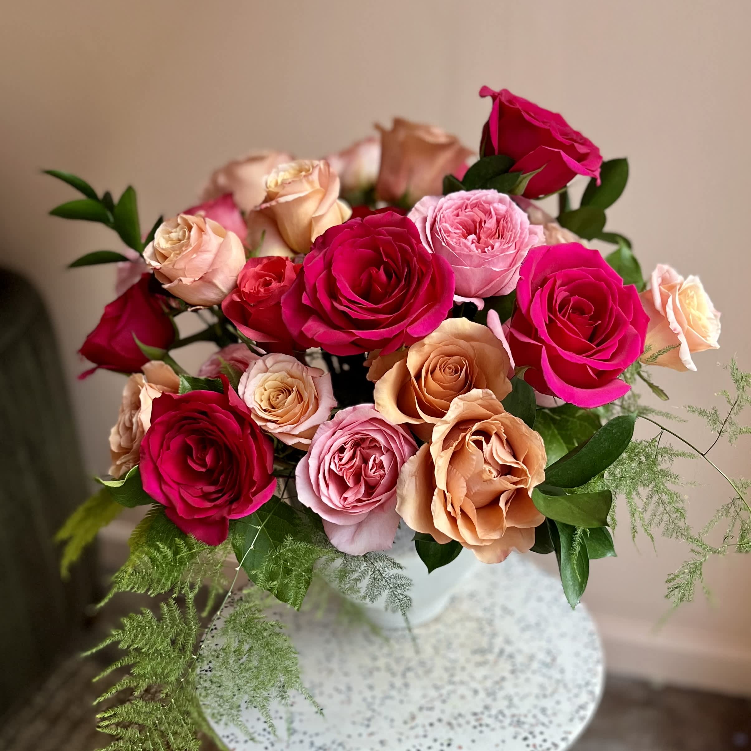 Carried Away - 30 amazing roses in ombre shades of blush, peach and coral designed in a lovely vase. A staff favorite!!  
