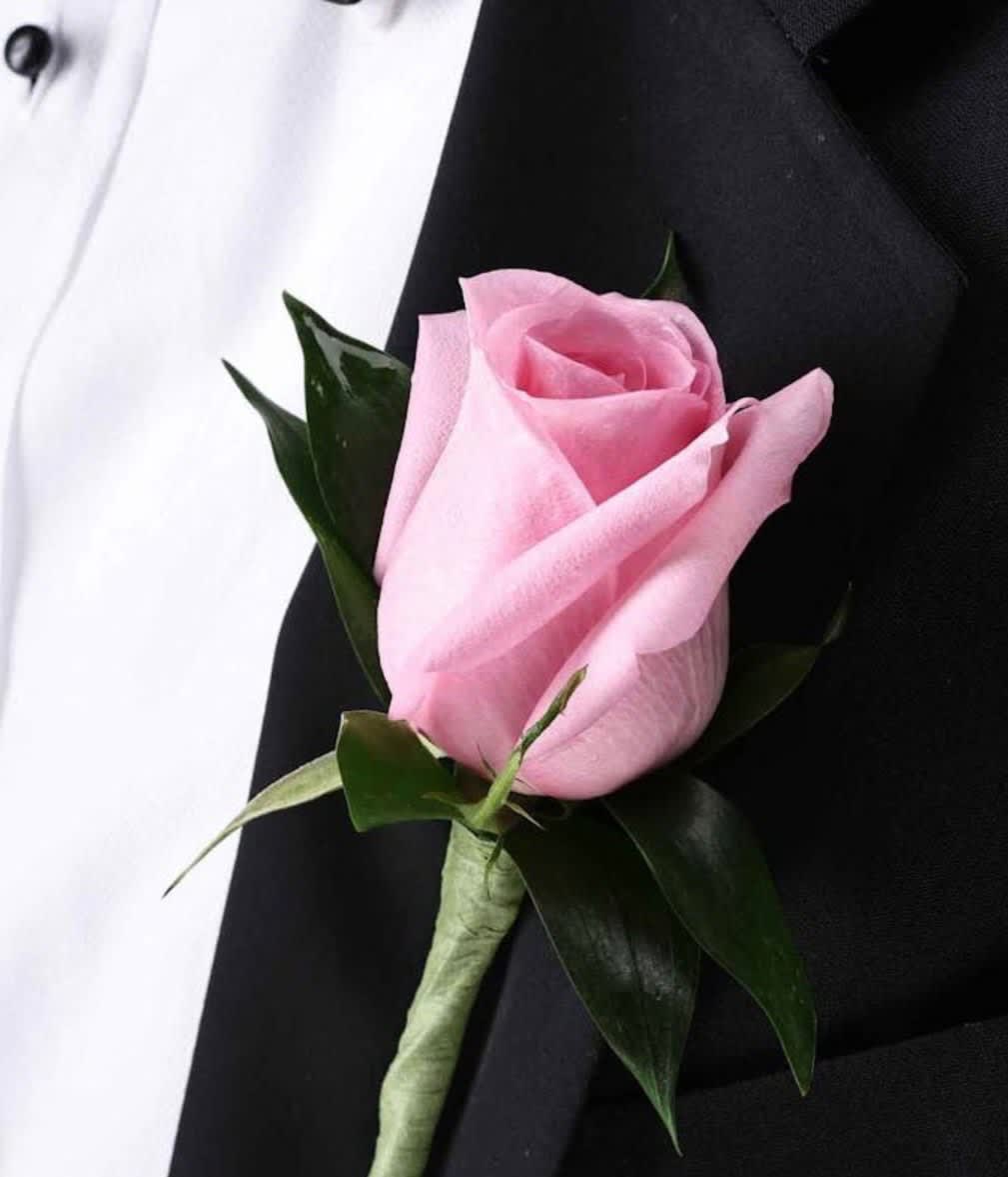 Light Pink Rose Boutonniere *Shade May Vary* Light Pink Rose Boutonniere *Shade May Vary* - Single Light Pink Rose with greenery. For specific Light Pink Shade please call store for assistance. **Deluxe option includes baby's breath accent