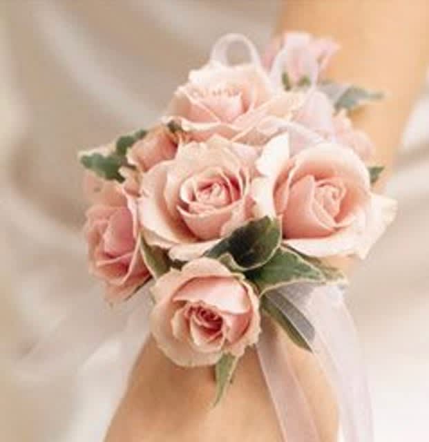Sweet Pinks Wrist Corsage - This mix of all miniature pink roses has a soft accenting of greenery.  If you would like a different ribbon color, please indicate so in the special instructions when checking out.  **Deluxe includes baby's breath**