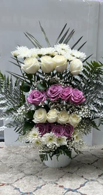 purple basket #2 - it is made with: 8 white roses 8 purple roses 4 baby breath 6 white pompom greens