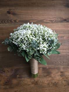 Country Chic Prom Bouquet Country Chic Prom Bouquet - A beautiful gathering of all baby's breath with assorted eucalyptus and greens surrounding. Your choice of color on the ribbon, please indicate on special instructions.