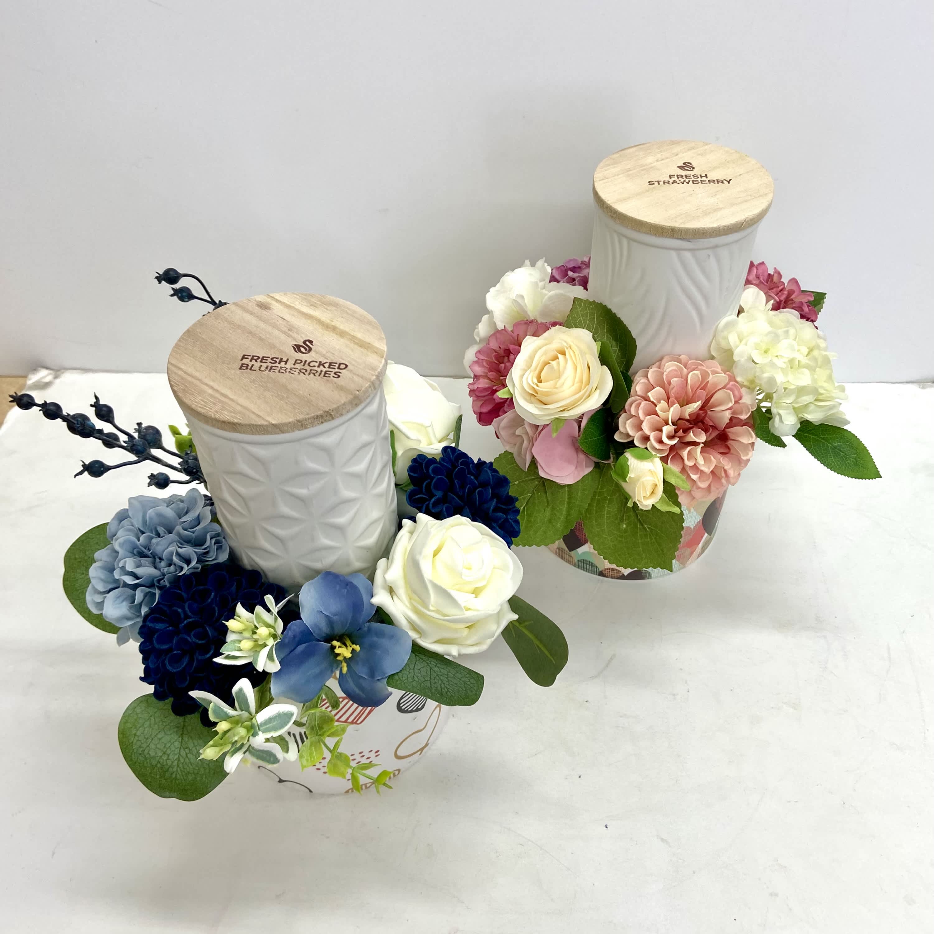 Swan Creek Soy Candles - Swan Creek soy candles in new fragrances Modern Lilac and Sunkissed Linen,Fresh Blueberry, classics like Citrus &amp; Sage and Fresh Strawberry. Surrounded by permanent flowers matching the fragrance.