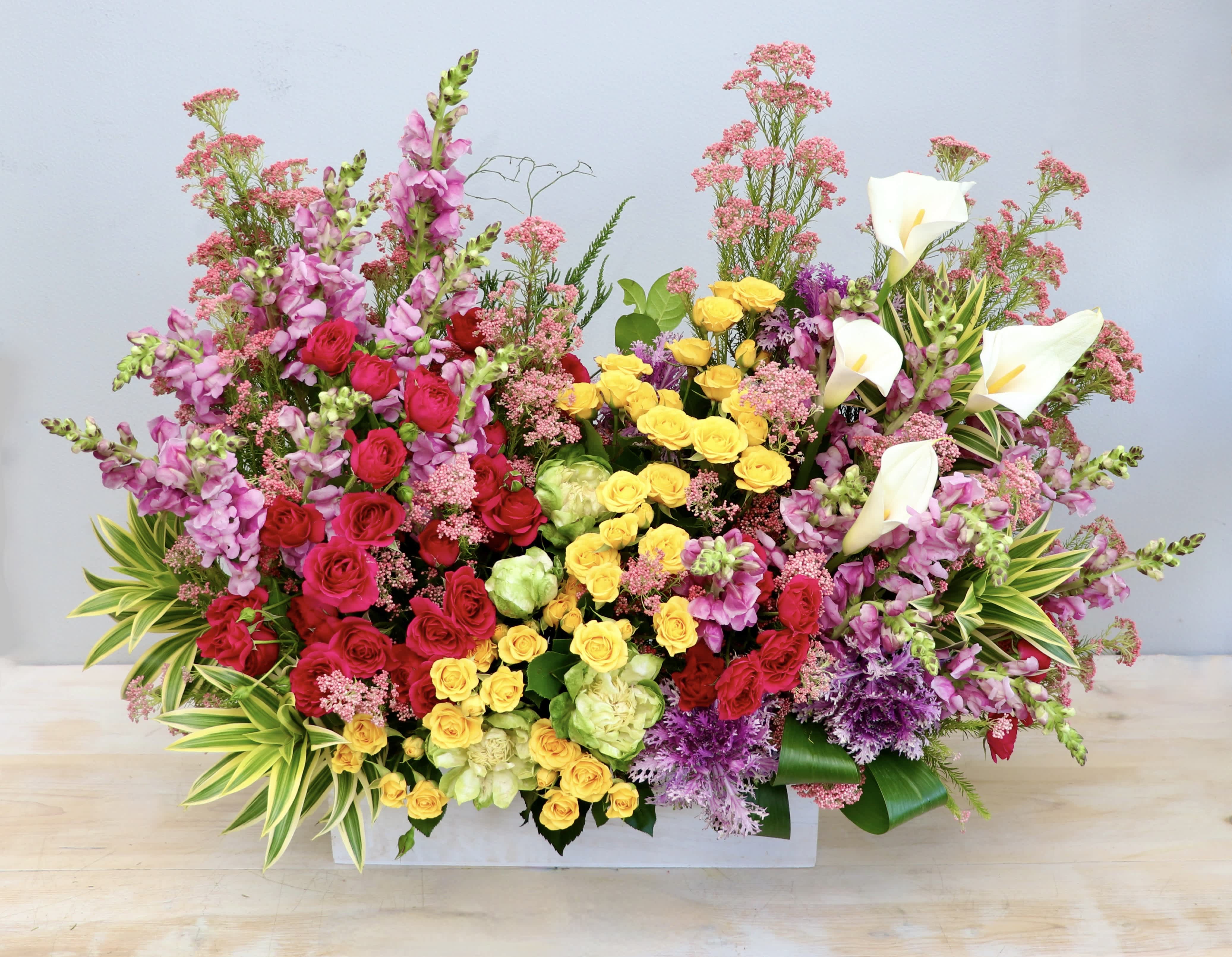 Pink and Yellow Garden Box - My Glendale Florist - This box arrangement is made a with bright yellow spray roses and pink blooms in varying shades. 