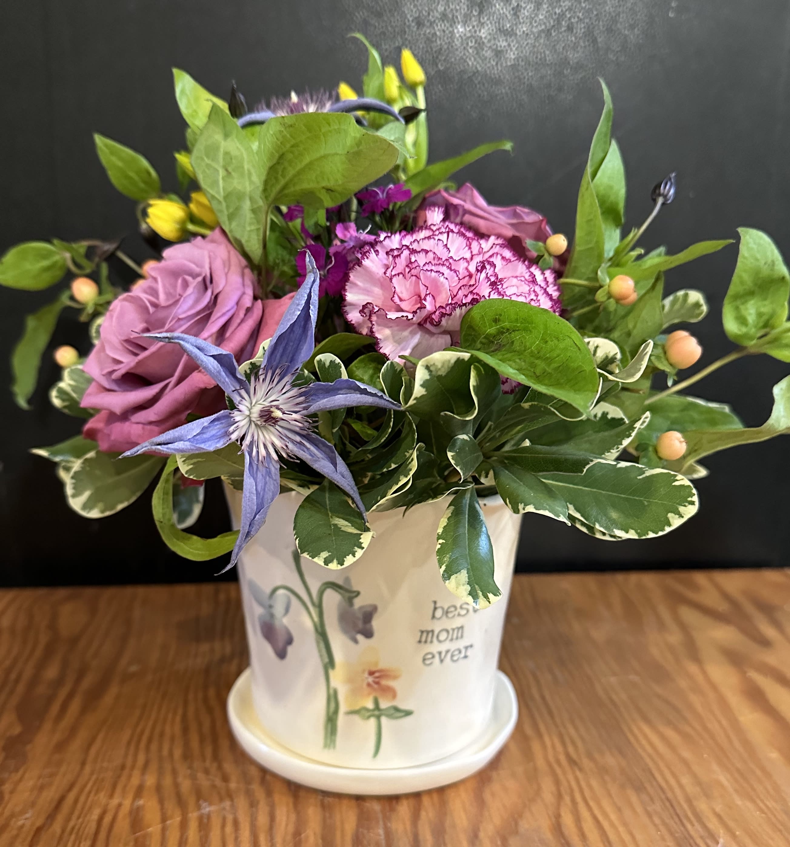 Best Mom - A beautiful selection of garden flowers will be gathered in our Best Mom Ever Container.     FLOWERS AND COLORS WILL VARY . Approximately 11”H  LIMITED QUANTITIES 
