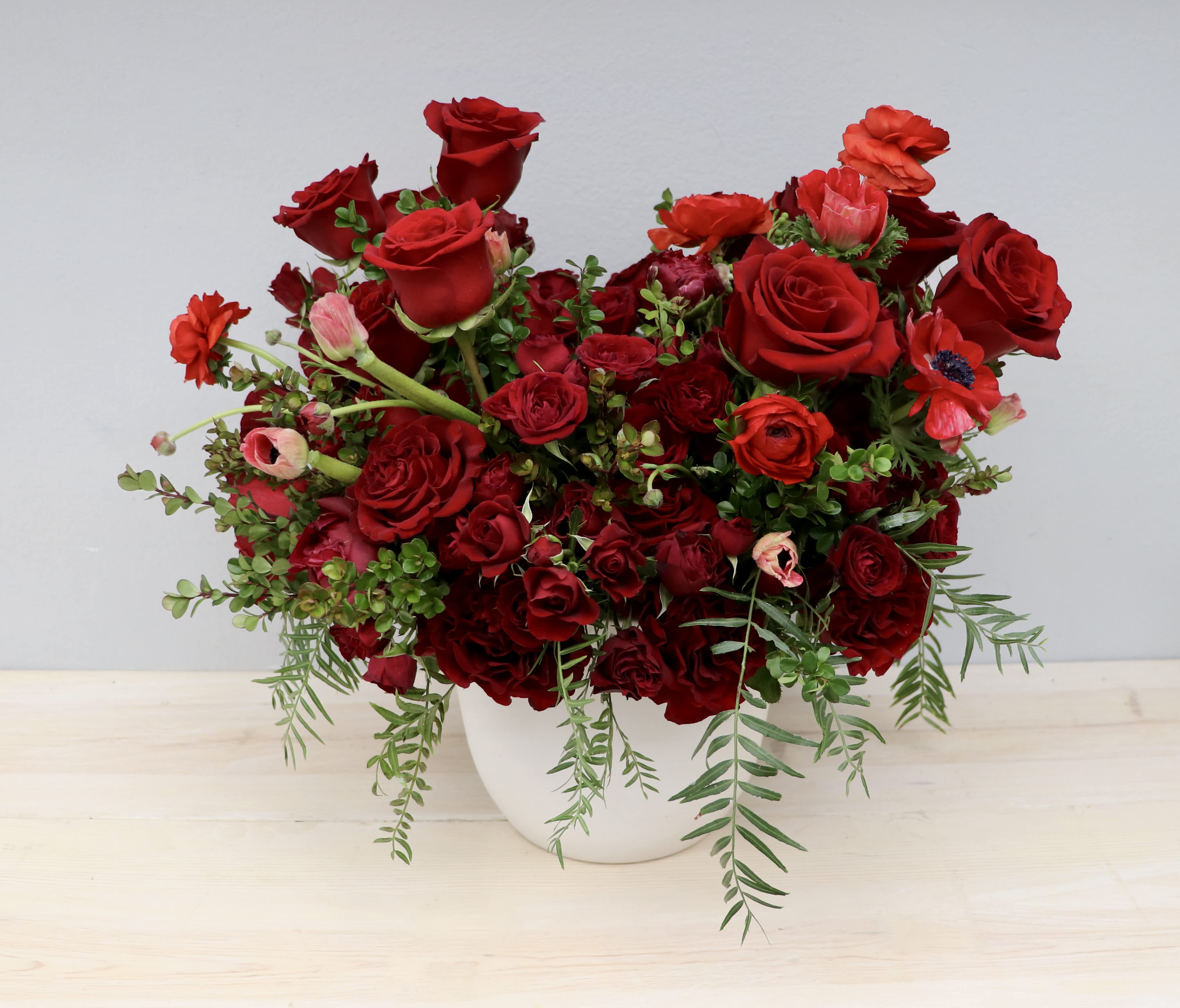 Crimson Serenade - My Glendale Florist  - This classic red rose arrangement is the sweetest reminder of your love for anyone in your life. Make sure to upgrade to deluxe or premium to send a larger arrangement with more florals!