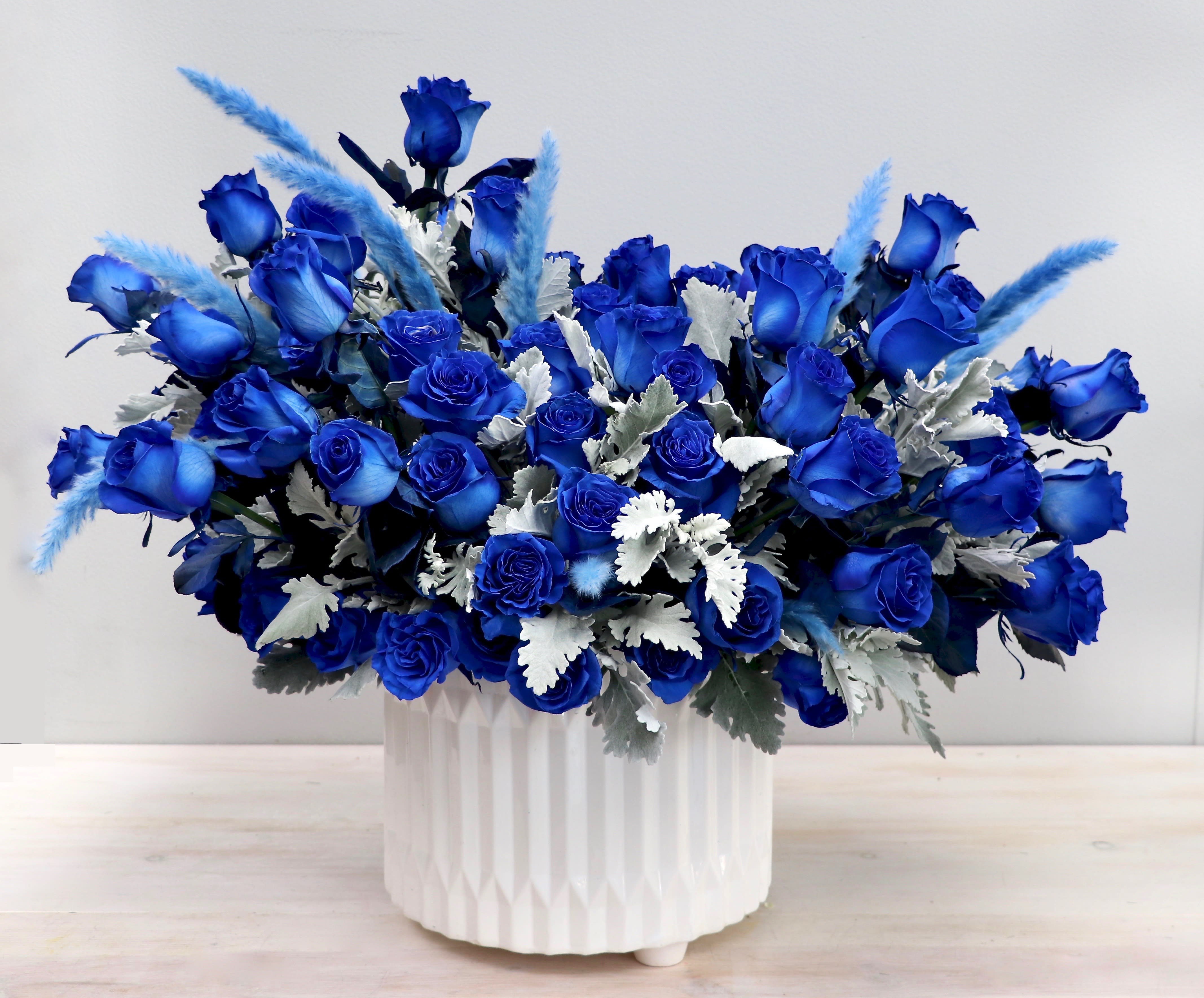 Rhythm and Blues - My Glendale Florist   - Don't miss out on this gorgeous arrangement featuring blue roses. The photo shown is displayed in the DELUXE size. Please order 24 hours in advance. 