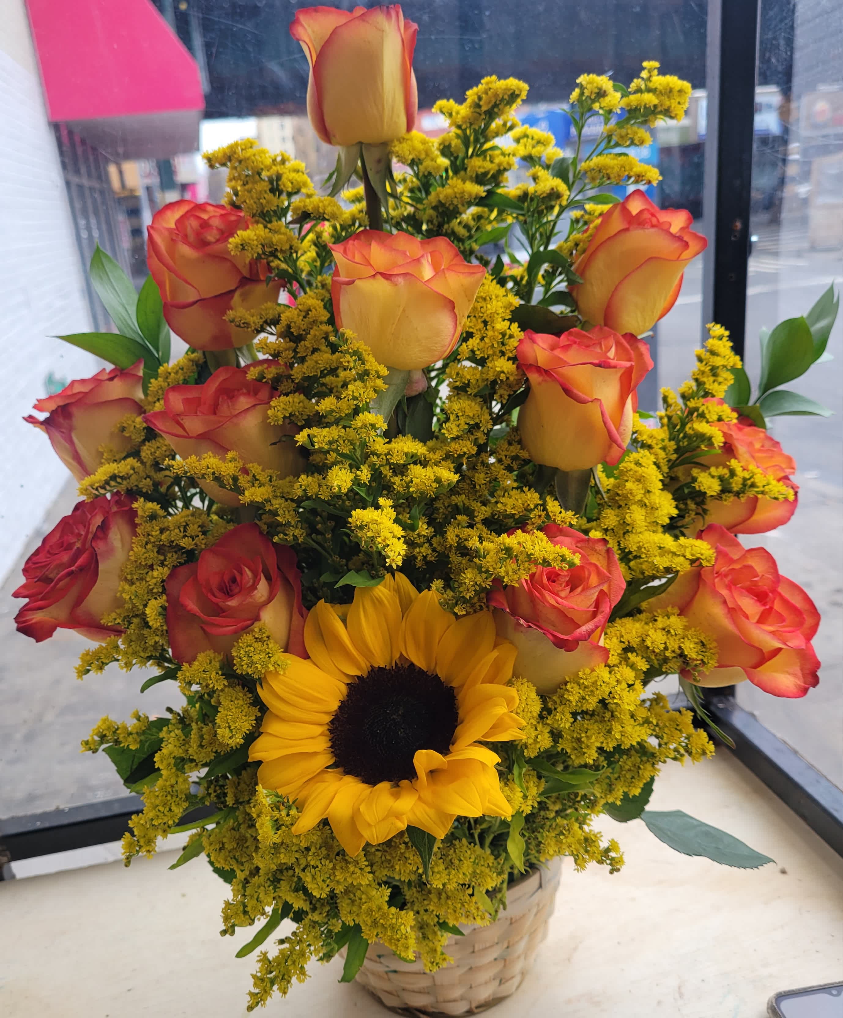 Basket Number 3 Basket Number 3 - it is made with: 12 orange/high magic roses 1 sunflower 8 solidagos greens