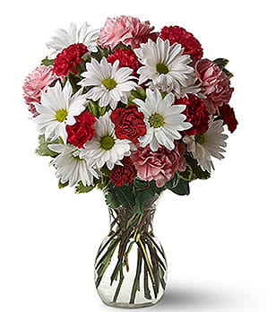 Love Bouquet - This cheery bouquet can help you recognize the loved one(s) in your life.  With the Carnations, Daisies &amp; variegated/dark greenery in a clear glass vase.  You will for sure bring a smile to their face! 